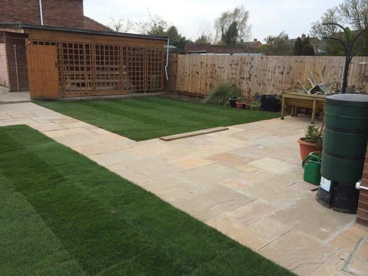 sand stone paving completely re turfed summer house install completed garden m