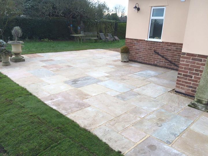 sunset buff sand stone patio laid and completed for a free quote please do not